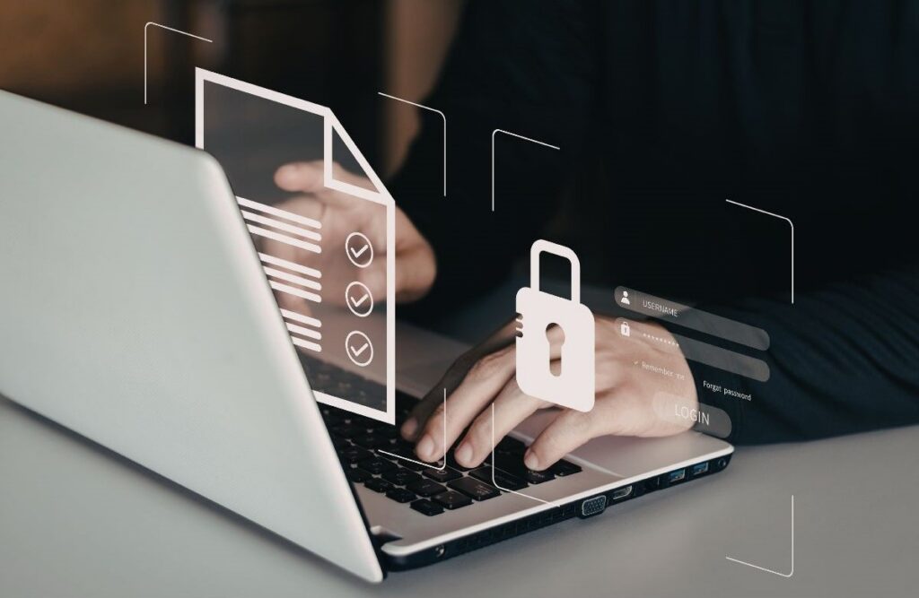 Person typing on a laptop with overlaid security icons including a lock, login fields, and verified documents, representing data security, authentication, and access control.