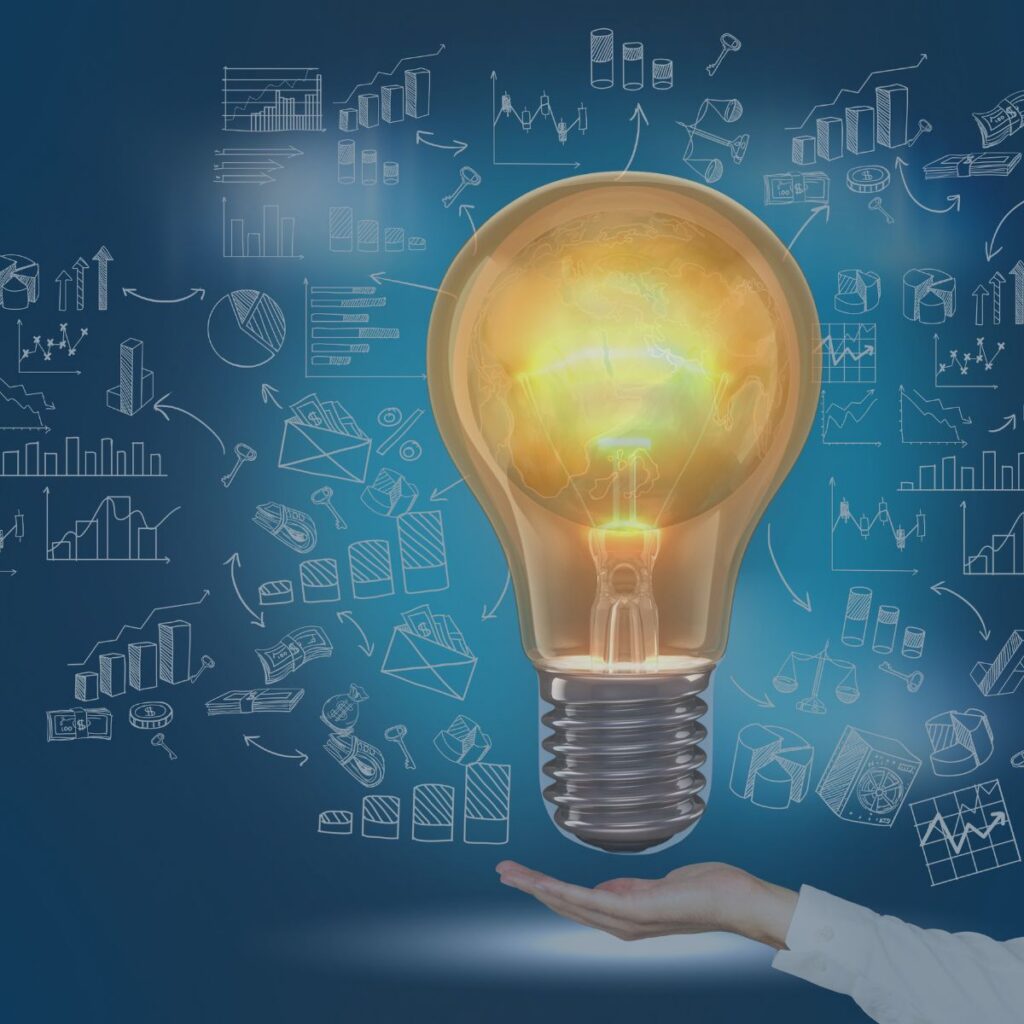 A glowing lightbulb hovering above an outstretched hand, surrounded by charts, graphs, and data icons on a blue background, representing ideas, analytics, and decision-making.