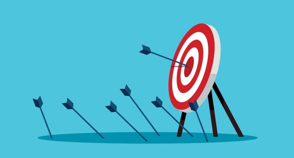 Illustration of a target with multiple arrows, one hitting the bullseye while others miss, representing precision and accuracy in achieving goals.