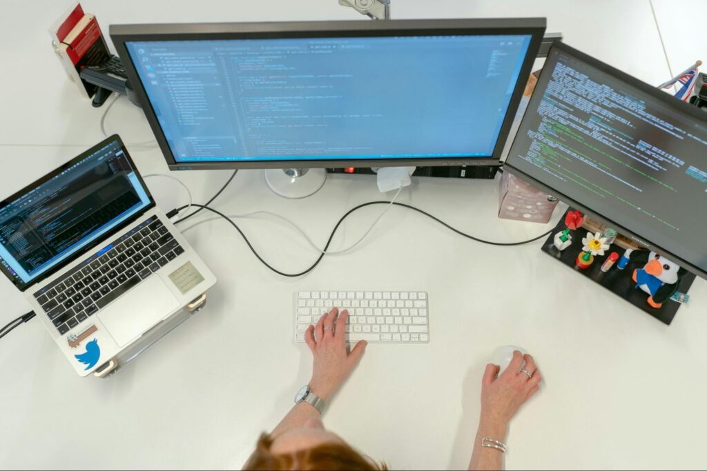 The image of a developer sitting at her desk, this visually communicates how human error in the engineering department can drain Productivity and Profit. The image of a developer sitting at her desk, this visually communicates how human error in the engineering department can drain Productivity and Profit.