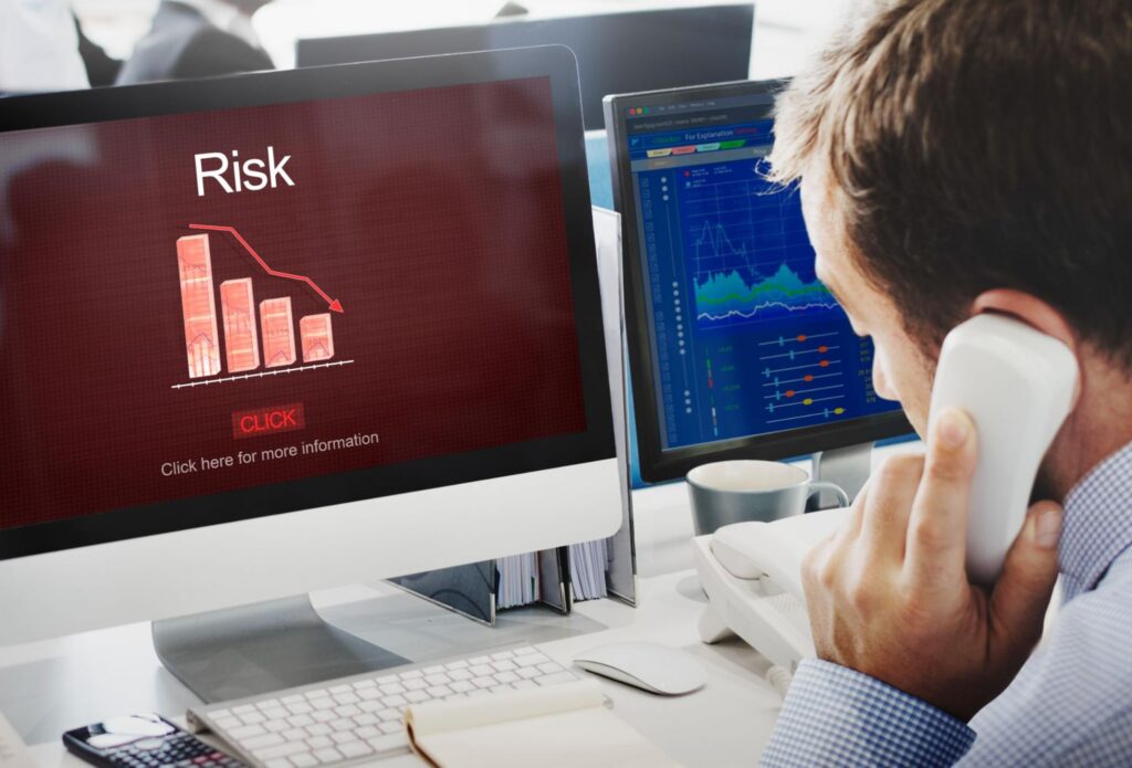 image of an executive looking at a computer screen showing risk of AI transformation