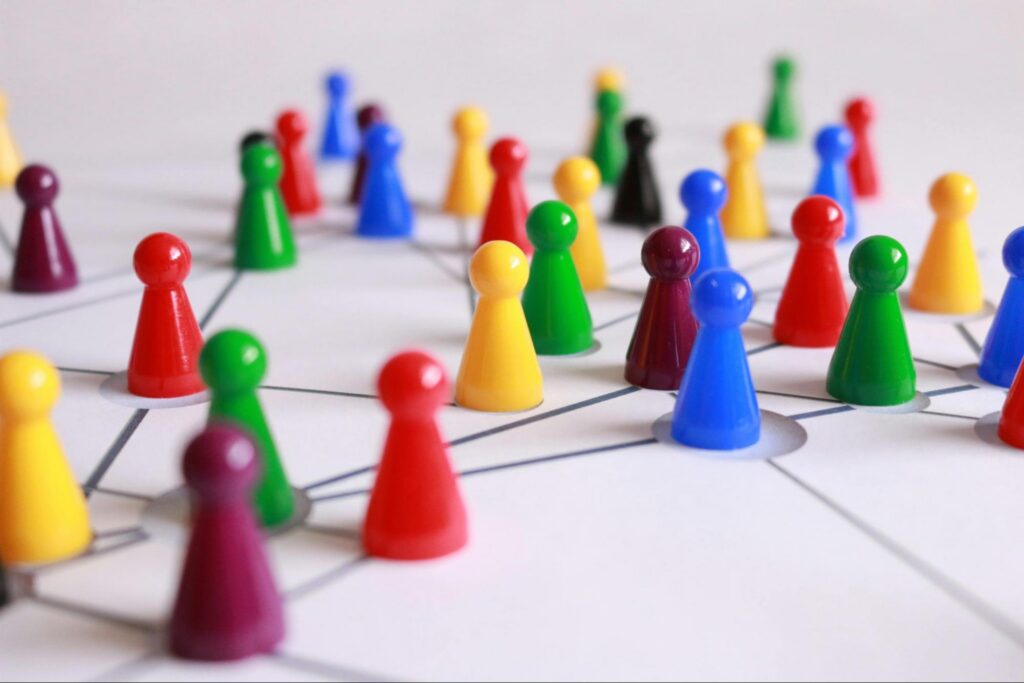 Image of small pawns denoting companies strategic movement around bureaucratic red tape. Image of small pawns denoting companies strategic movement around bureaucratic red tape.