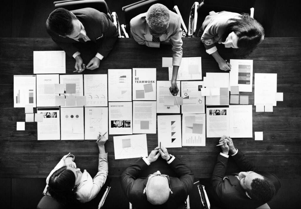 A corporate team working together and displaying teamwork. A corporate team working together and displaying teamwork.